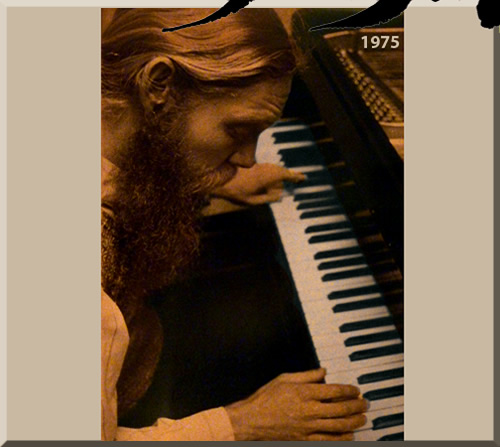 Photo of Jerry Michelsen in nineteen seventy-five performing on a grand piano. He had long, blonde hair and a red beard.